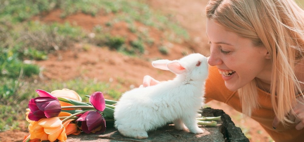 Beautiful,Young,Woman,With,Bunny,Rabbit,On,Farm.,Happy,Easter.